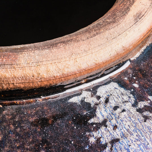 Close-up of a Vicalhome modern home decor vase with a textured rim and glossy finish